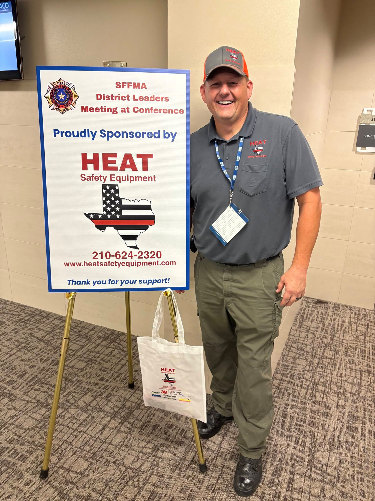 A man stands beside a sign labeled "Heat," indicating a focus on temperature or warmth.